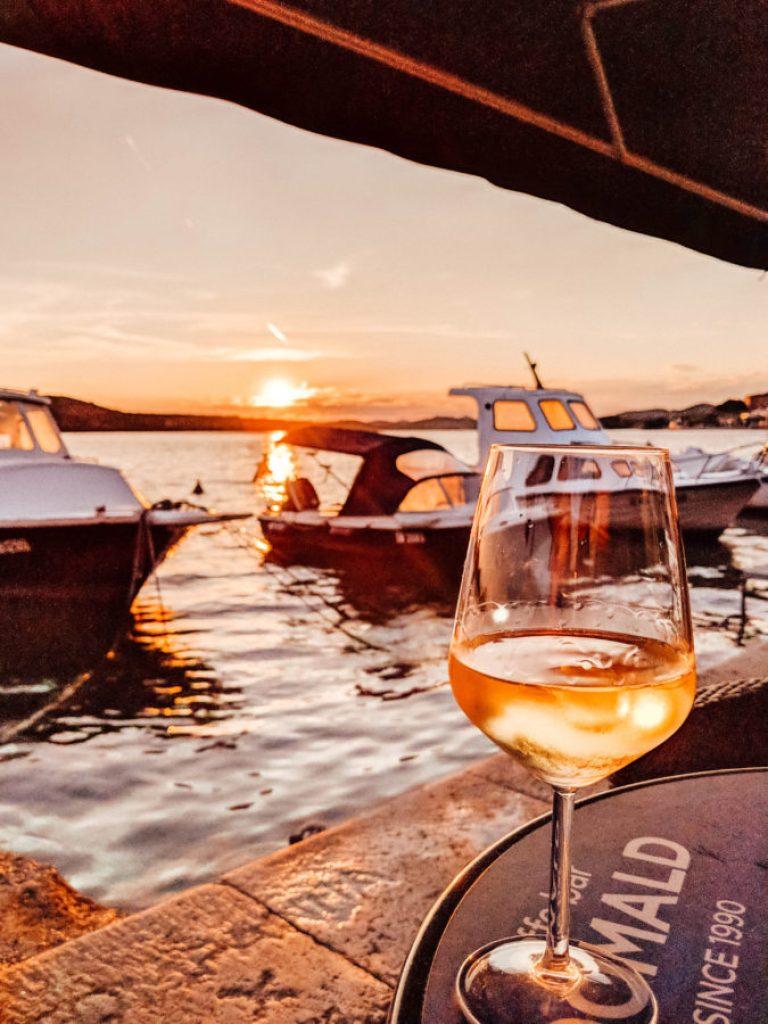 A glass of Babic wine at sunset in Šibenik, Croatia | 10 Amazing Things to Do in Šibenik, Croatia